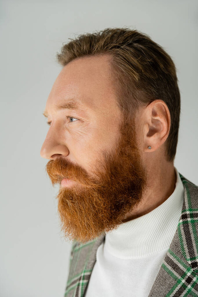 Bearded man in plaid jacket looking away isolated on grey  - Foto, afbeelding