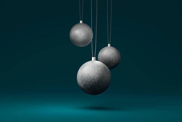 Tres bolas de árbol de Navidad de plata aisladas sobre un fondo azul. ilustración 3d - Foto, imagen