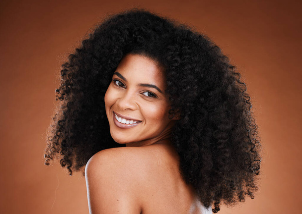 Curly hair, black woman and natural skincare, portrait and beauty for makeup, confidence or facial cosmetics, aesthetic and wellness on studio background. Happy african model face, afro and happiness. - Foto, Imagen