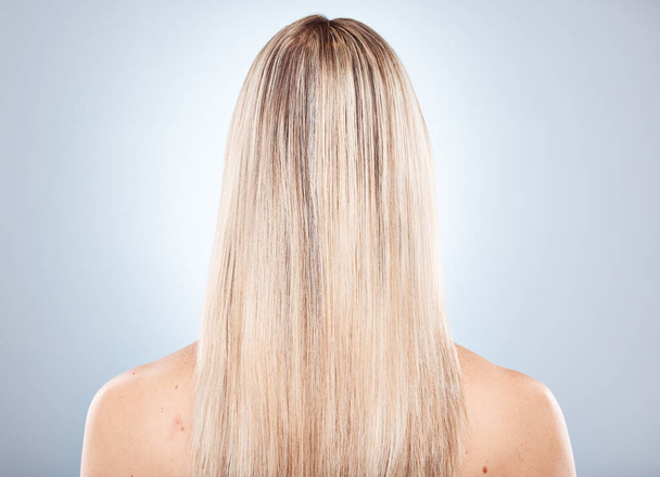 Woman, hair and back of a blonde woman with keratin treatment hairstyle or hair care. Beauty salon, blond hair and hair style or haircare of a lady with healthy, beauty and long healthy hair. - Foto, Bild