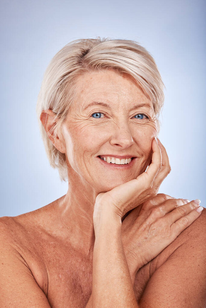 Senior woman, beauty and face, skincare and dermatology wellness for wrinkles, anti aging cosmetics and healthy skin on studio background. Portrait of happy mature lady, body care and aesthetic glow. - Photo, image