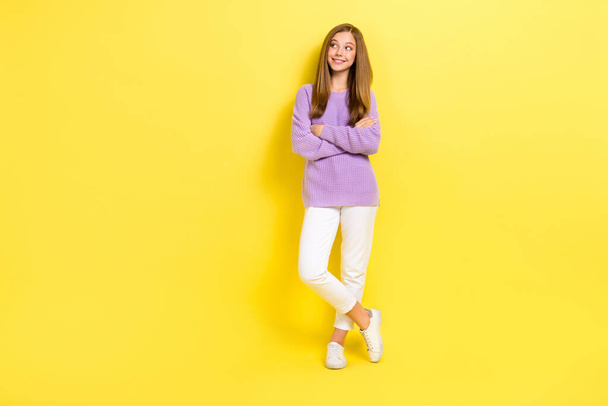 Full length photo of positive adorable dreamy lady dressed stylish clothes interested look empty space isolated on yellow color background. - Foto, Bild