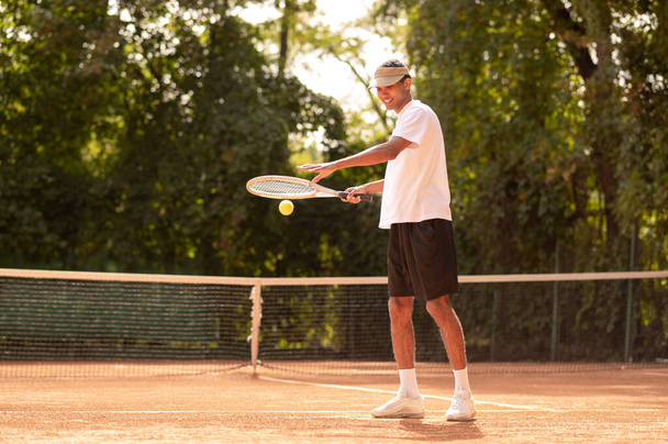 Workout. Young tennis player having a workout at the tennis courts - 写真・画像