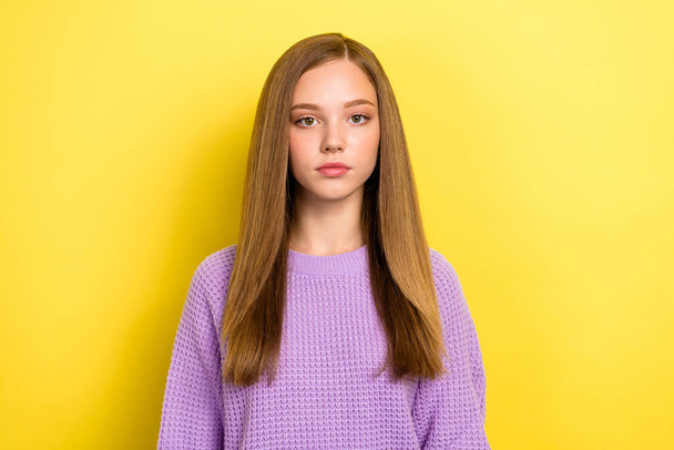 Photo of cute pretty lady schoolkid calm face dressed comfort warm pullover look camera isolated on yellow color background. - Zdjęcie, obraz