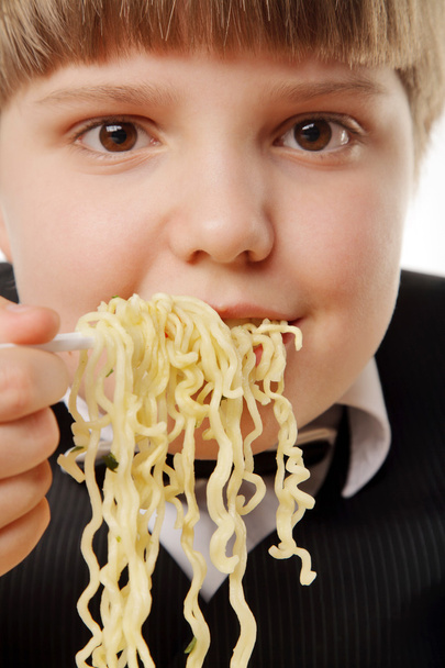 Boy eating instant noodles - Photo, Image