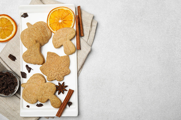 Flat lay composition with baked biscuits of different shapes on light table. Space for text - Фото, зображення
