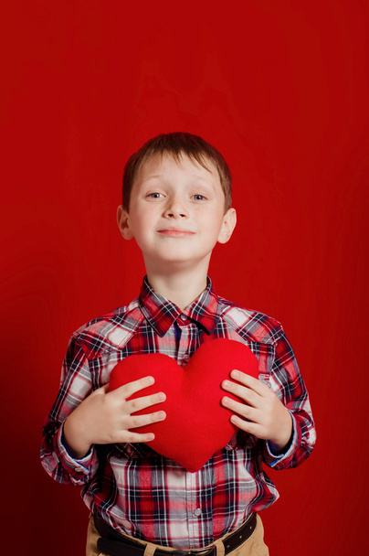 Little boy with a heart of toy - 写真・画像