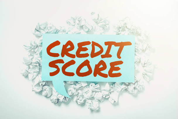 Hand writing sign Credit Score, Conceptual photo numerical expression that indicates a person s is creditworthiness - Photo, Image