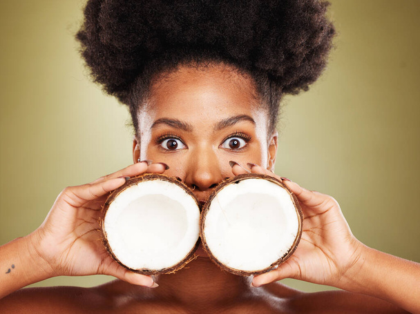 Skincare, beauty and portrait of black woman with coconut in studio on brown background. Wellness, body care and eyes of girl with fruit for healthy, organic and natural cosmetic products and makeup. - Zdjęcie, obraz