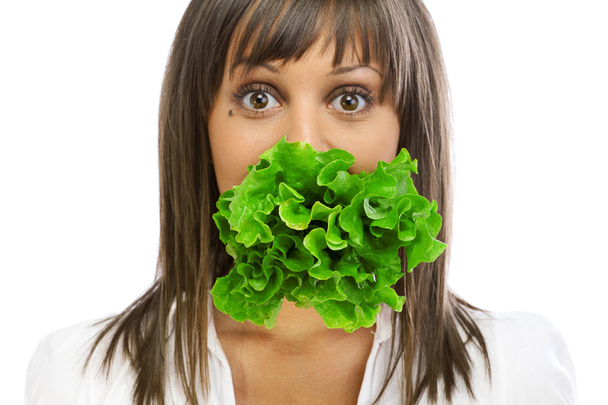 Young woman eating fresh salad - Fotografie, Obrázek