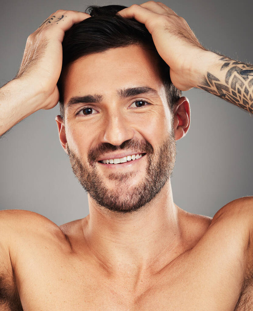 Skincare, happy and portrait of a man with a smile for wellness, beauty and dermatology against grey studio background. Cosmetic, healthy and face of a model with happiness for hygiene and freshness. - Foto, immagini