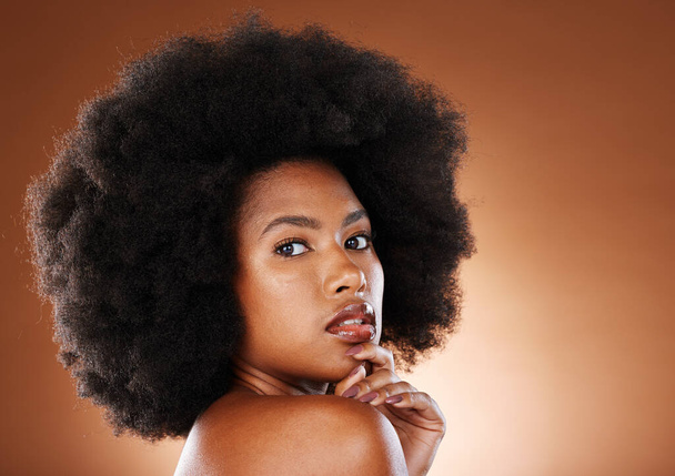 Beauty, natural hair and black woman with afro in natural cosmetics portrait, makeup advertising against studio background. Skincare, face cosmetic and hair care with glowing skin and wellness mockup. - Foto, Imagen