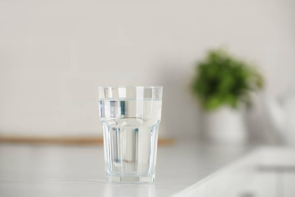 Glass of pure water on table indoors - Photo, image