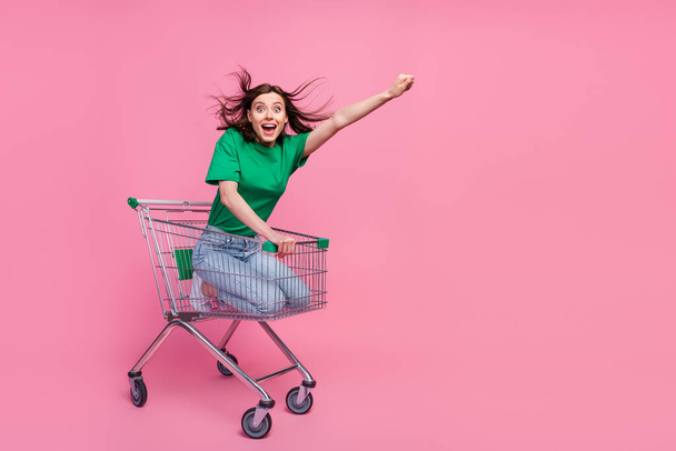 Full body portrait of excited amazed lady raise arm empty space isolated on pink color background. - Foto, immagini