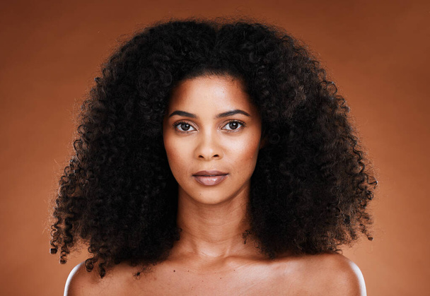 Beauty, hair care and portrait of black woman with skincare treatment, luxury facial cosmetics or clean glowing skin. Self care routine, makeup and face of model with afro hair volume after spa salon. - Foto, immagini