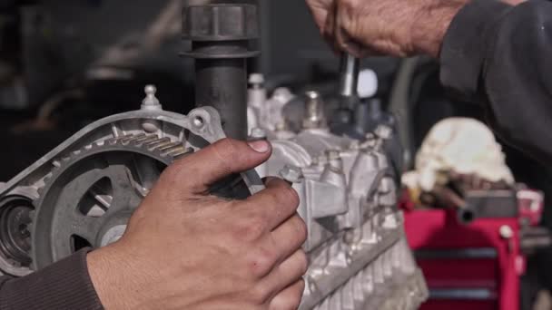 Mechanic Covers Valve of Car Engine with Socket Wrench in Repair Shop Footage. - Footage, Video