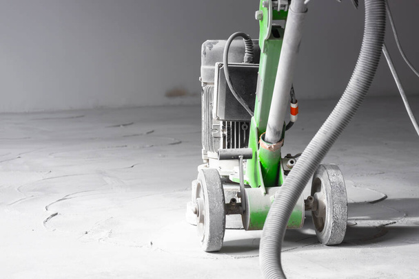 Grinding concrete industrial floors, lots of dust when grinding concrete with large professional grinders. - Photo, Image