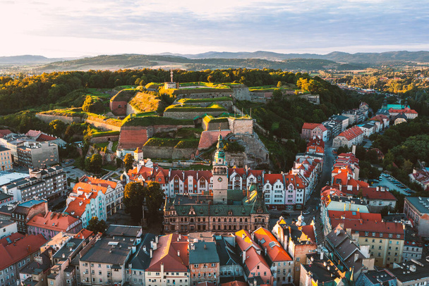 Top view of the old town in Klodzko, a city at the foot of the fortress, a beautiful Polish cityscape at sunset - Photo, Image