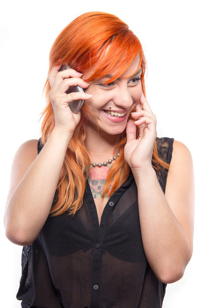 Pretty redhead girl laughing into the mobile - Foto, Imagem