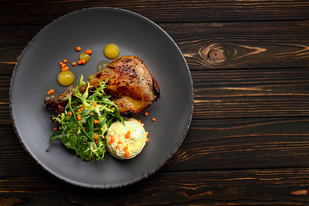 Baked duck leg with herbs, pumpkin and sauce - Foto, immagini