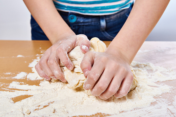 Kneading dough on girl hands - Фото, зображення