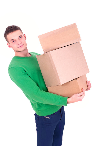 Handsome man carrying boxes - Foto, Imagen
