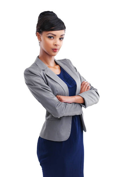 Corporate confidence. Cropped portrait of a young businesswoman standing with her arms folded against a white background - Фото, зображення