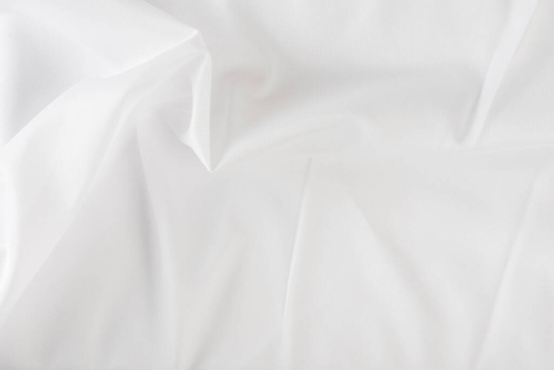 White wrinkled fabric. White fabric with large folds top view. For overlay texture or design - Fotografie, Obrázek
