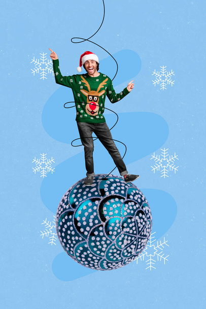 Vertical collage image of excited mini guy stand big bauble ball tree toy dancing point fingers isolated on drawing snowflakes background. - Φωτογραφία, εικόνα
