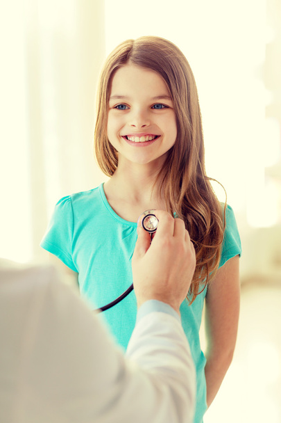 male doctor with stethoscope listening to child - Photo, image