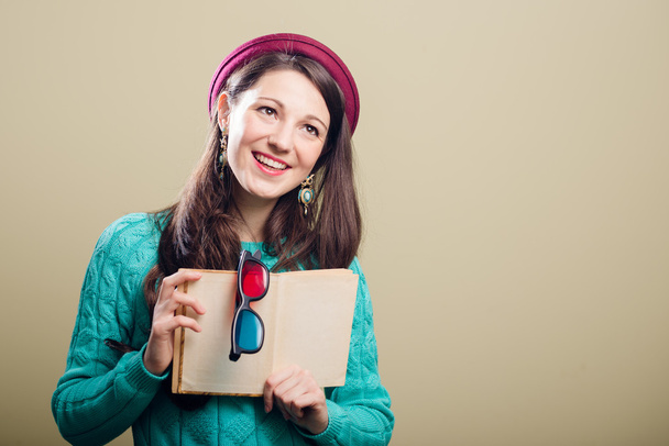 Girl holding a book and 3d glasses - Valokuva, kuva