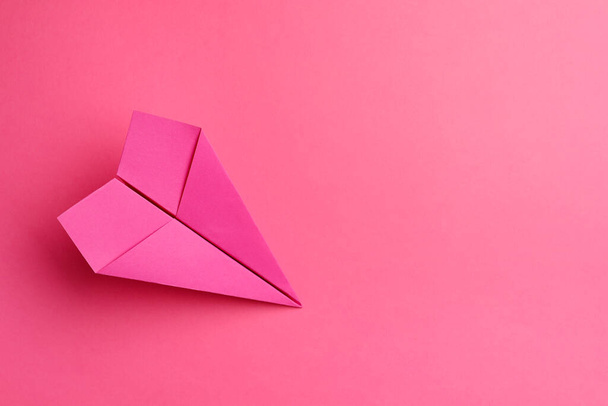 Handmade paper plane on pink background, top view. Space for text - Fotó, kép