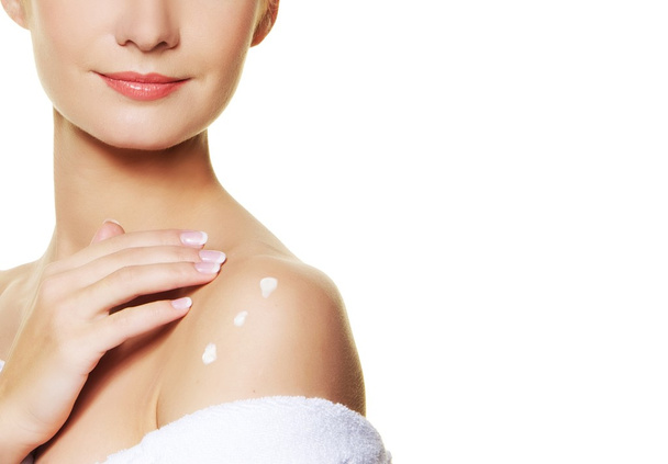 Woman applying moisturizer cream on ner body - Photo, Image