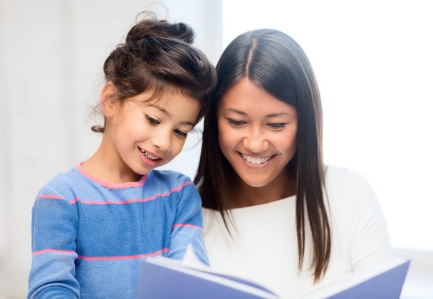 mother and daughter with book - Photo, Image