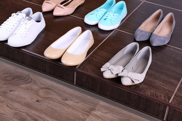 Different shoes on floor - Foto, imagen