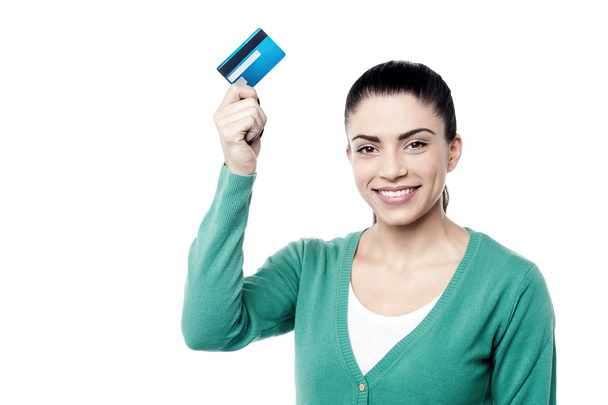 Woman showing her credit card - 写真・画像