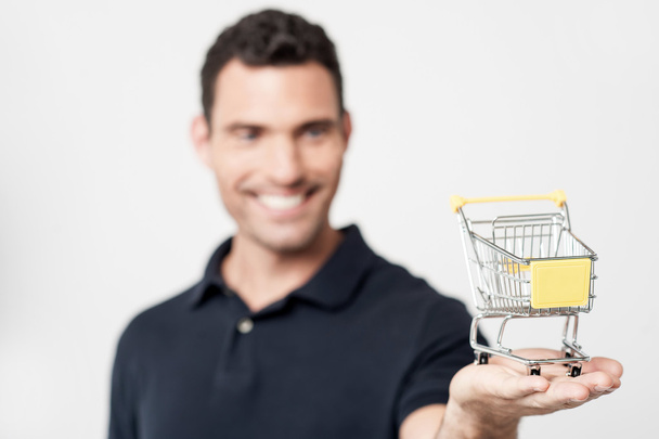 Man holding shopping cart - Foto, immagini