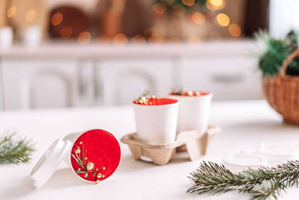 Christmas cake to go in white disposable cups on coasters. - Фото, изображение