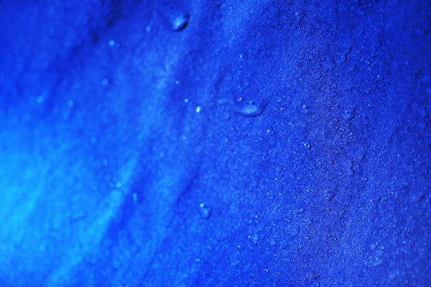 Water drops on color surface background, macro view - Fotó, kép