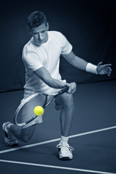 Young man playing tennis - Фото, изображение