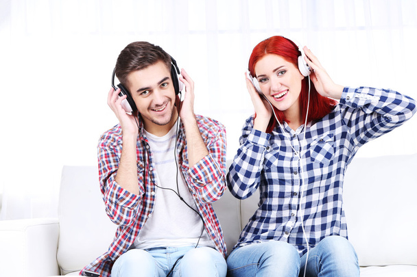 Couple listen to music at home  - Фото, зображення