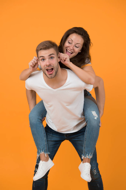 Going crazy together. Woman and handsome man crazy mood. Couple crazy in love having fun. Feeling free and crazy. Young people. Family time. Piggybacking girlfriend. Cheerful mood. Positive emotions. - Foto, immagini