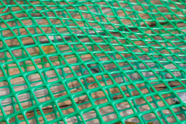 Plastic fence background, green fence close-up and texture - Foto, afbeelding