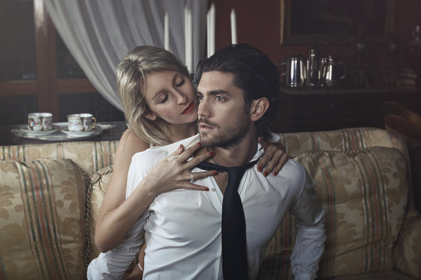 Seductive woman undressing handsome man - Foto, Imagem