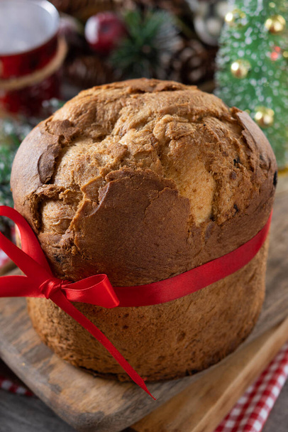 Traditional Christmas panettone on wooden table - Photo, Image