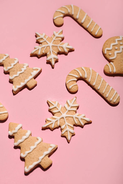 Set of tasty Christmas cookies on pink background - Photo, Image