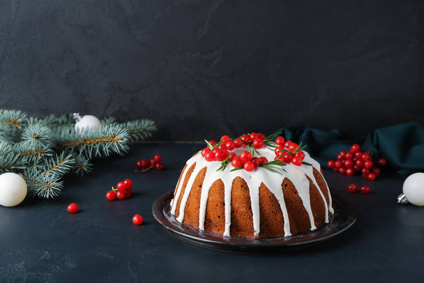Traditional Christmas cake with cranberry on dark background - Фото, зображення