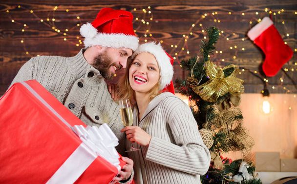 Happy family. Family celebrating xmas at home. Family respect christmas traditions. Man and woman santa hats thankful for received gift. Boxing day. Couple in love new years eve. Pleasant surprise. - Zdjęcie, obraz