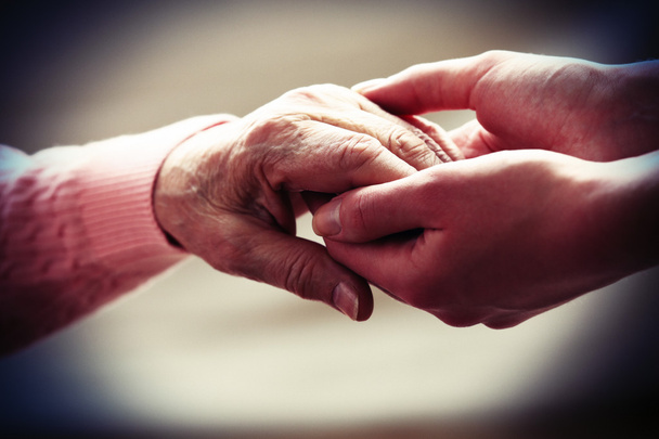 Old and young holding hands - Photo, image