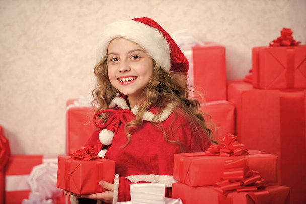 Winter happiness concept. Explore christmas gifts. Unpacking christmas gift. New year holiday tradition. Kid excited about opening christmas present. Girl celebrate christmas. Santa bring her gift. - Φωτογραφία, εικόνα